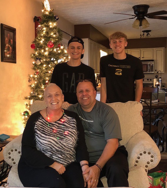 Karen's family at home around the Christmas tree